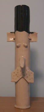 Photo: Front view of a ceramic tube made to look like a man's neck and head.