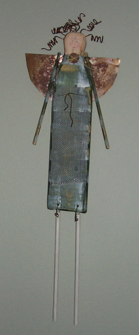 Sculpture: Angel, by Linda Kozak Nash, a wooden angel with metal hair and wings, and wooden arms and legs.  Copyright © 1998, Linda Kozak Nash.