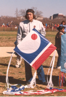 Photo: Red Dot #3 kite being held by Mike Carroll at the Smithsonian Institute's Kite Festival, 1986.  Photo by Jenny Williams.