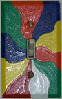 Photo: Painted switchplate of an abstract color swirl, by Cathy Williams Carroll.