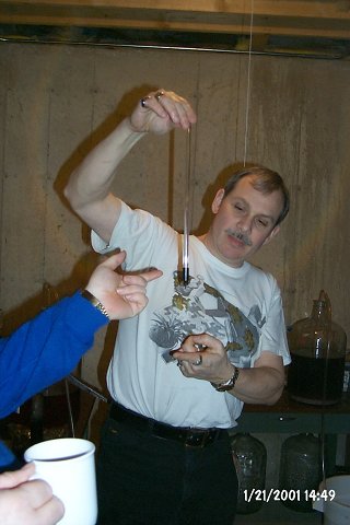 The bottom end of the siphon has a valve that stops the flow when the tip is lifted off the bottom of the bottle.