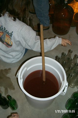 After each carboy is siphoned, and before the bottles are filled, sugar is added to feed the yeast.