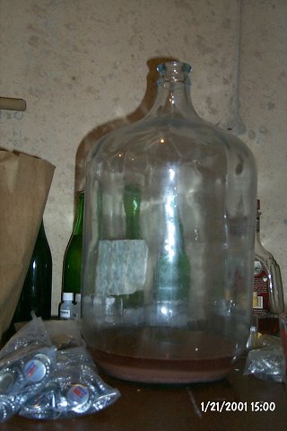 The last inch or two at the bottom of the carboys is yeast sludge. It's discarded.