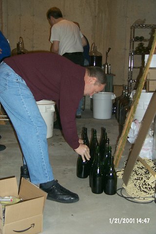 After the disinfectant rinse, the bottles wait to be filled.