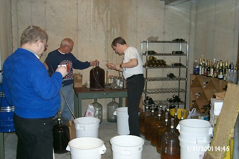 Setting up the first carboys for siphoning.