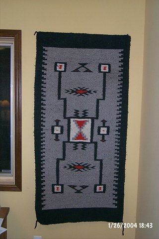 Unknown artist, wool rug woven in Native American motif.