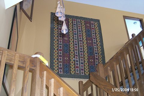 The view from the family room door.
We've decided this will be the Karen Borruso Friendship Landing.
The bells are a gift from her, and Cathy bought the rug on a dangerous shopping spree with her last Easter.
Karen has the companion rug (but she walks on hers...).