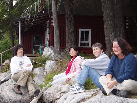 Lulu, Wendy, Gail, and Nina at the water's edge.