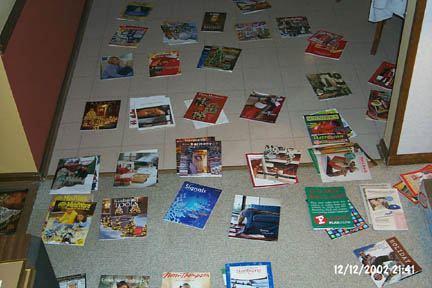 Catalogs strewn on the floor: "Look's like they're planning a garden path..."